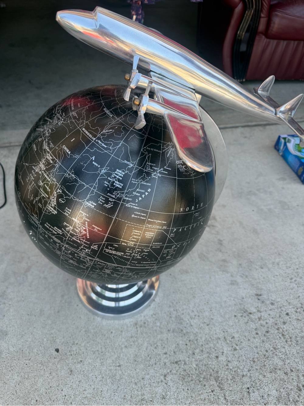 Decorative Black Globe with Silver Airplane Accent